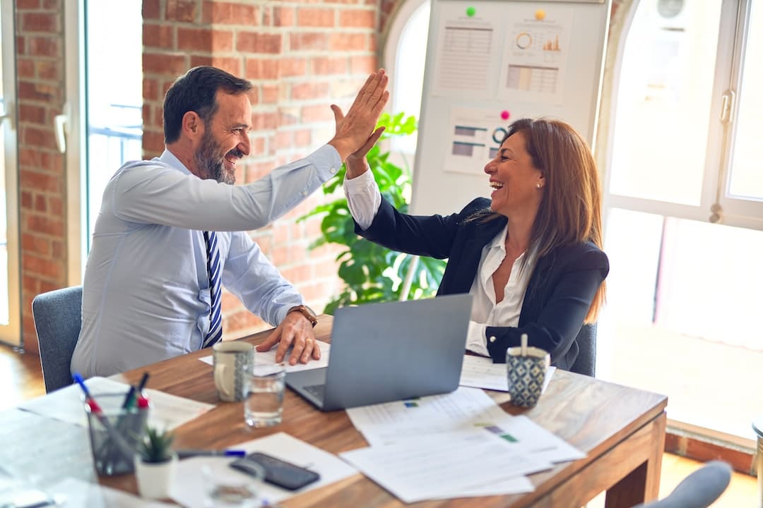 Ge showcasing a diverse couple examining colorful pie charts, depicting their individual financial backgrounds, next to a pair of compasses, symbolizing their journey to navigate finances together